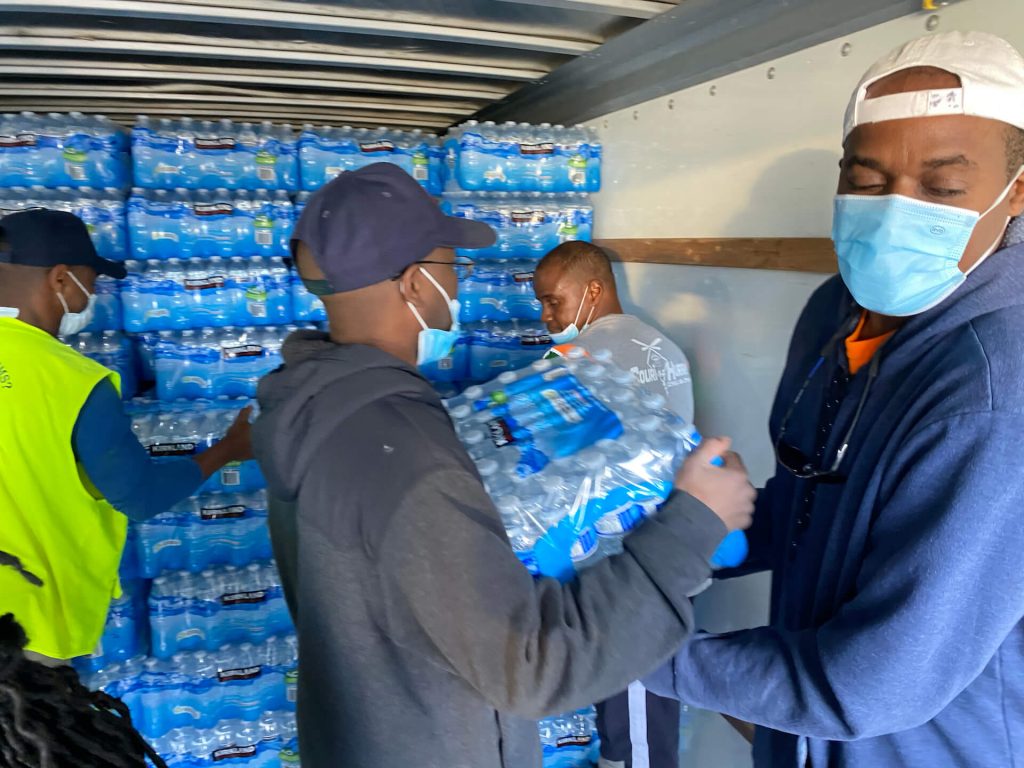 At the Oakwood University Seventh-day Adventist Church in Hunstville, Alabama, volunteers load donated water bottles into a truck bound for Texas. Photo provided by Oakwood University Church